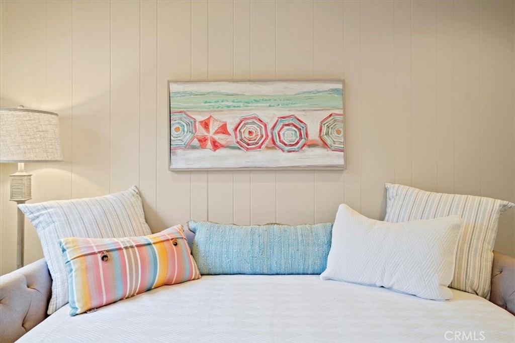 23802 Cassandra Bay Dana Point, CA 92629 - Photo 43 of 56 a bedroom with a white bed and a couch