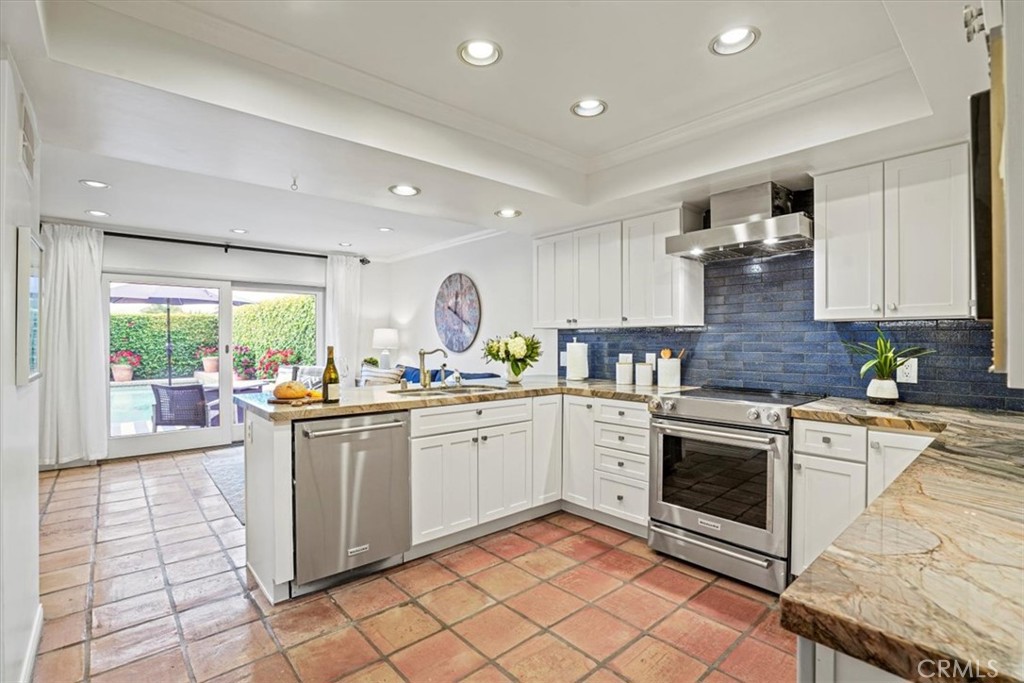 23802 Cassandra Bay Dana Point, CA 92629 - Photo 10 of 56 a kitchen with stainless steel appliances granite countertop a stove a sink and a refrigerator