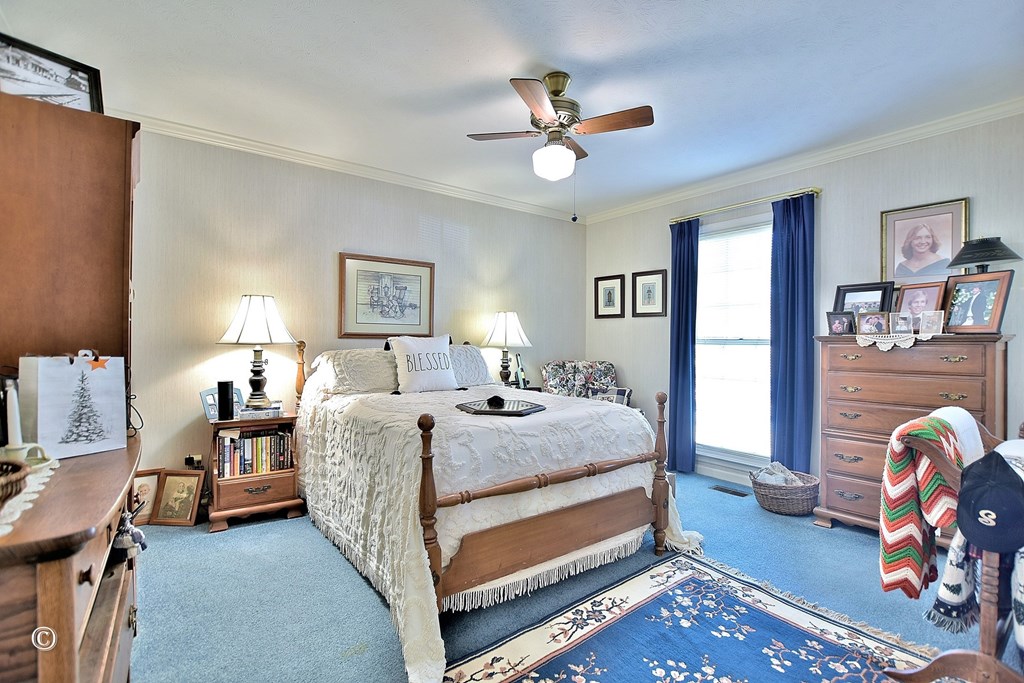 5002 Sears Court Columbus, GA 31907 - Photo 25 of 35 a bedroom with a bed and a chandelier