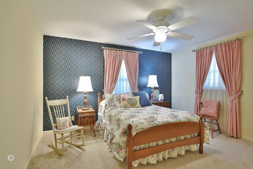 5002 Sears Court Columbus, GA 31907 - Photo 28 of 35 a bedroom with a bed and a chandelier
