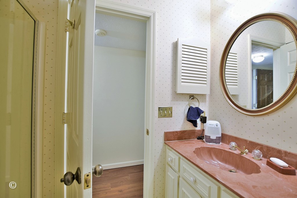 5002 Sears Court Columbus, GA 31907 - Photo 29 of 35 a bathroom with a granite countertop sink a mirror and a shower