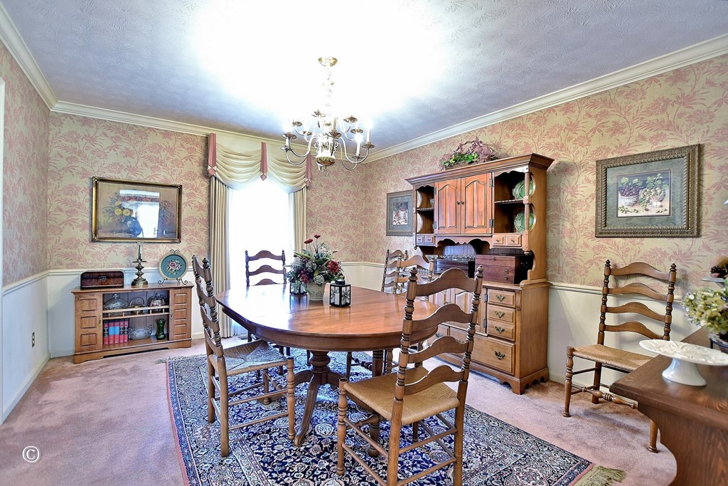 5002 Sears Court Columbus, GA 31907 - Photo 6 of 35 a view of a dining room with furniture and chandelier