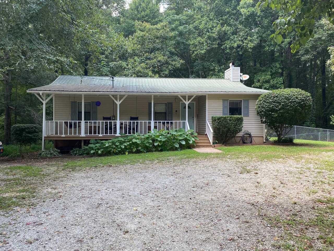 1845 Yarbrough Ridgeway Road Maysville, GA 30558 - Photo 1 of 1 a front view of a house with garden