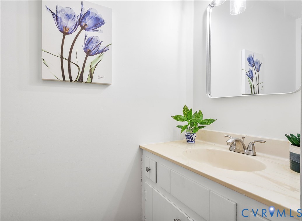 3121 Quail Hill Drive Midlothian, VA 23112 - Photo 17 of 37 a bathroom with a sink and a mirror
