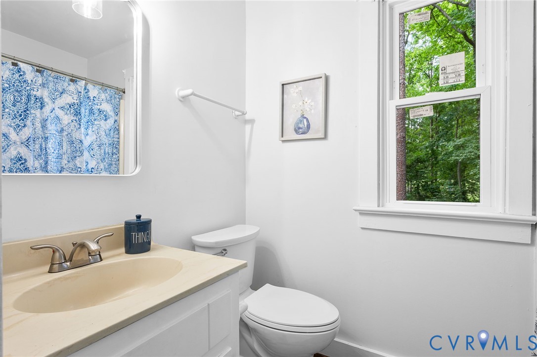 3121 Quail Hill Drive Midlothian, VA 23112 - Photo 28 of 37 a bathroom with a toilet a sink and a window