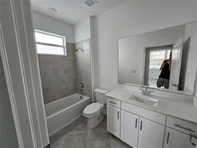 a view of an empty room with windows