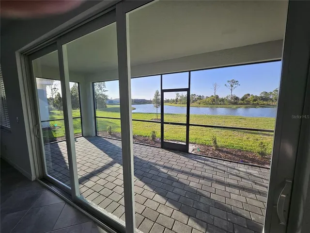 a view of a porch with a floor to ceiling window