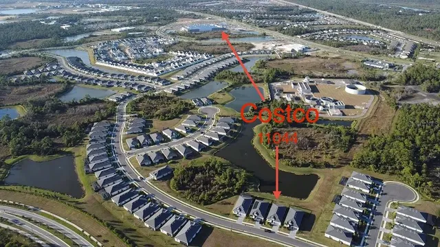an aerial view of multiple houses with outdoor space