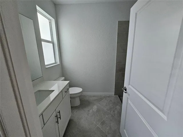 a bathroom with a sink and toilet