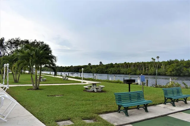 a view of a park with lounge chairs