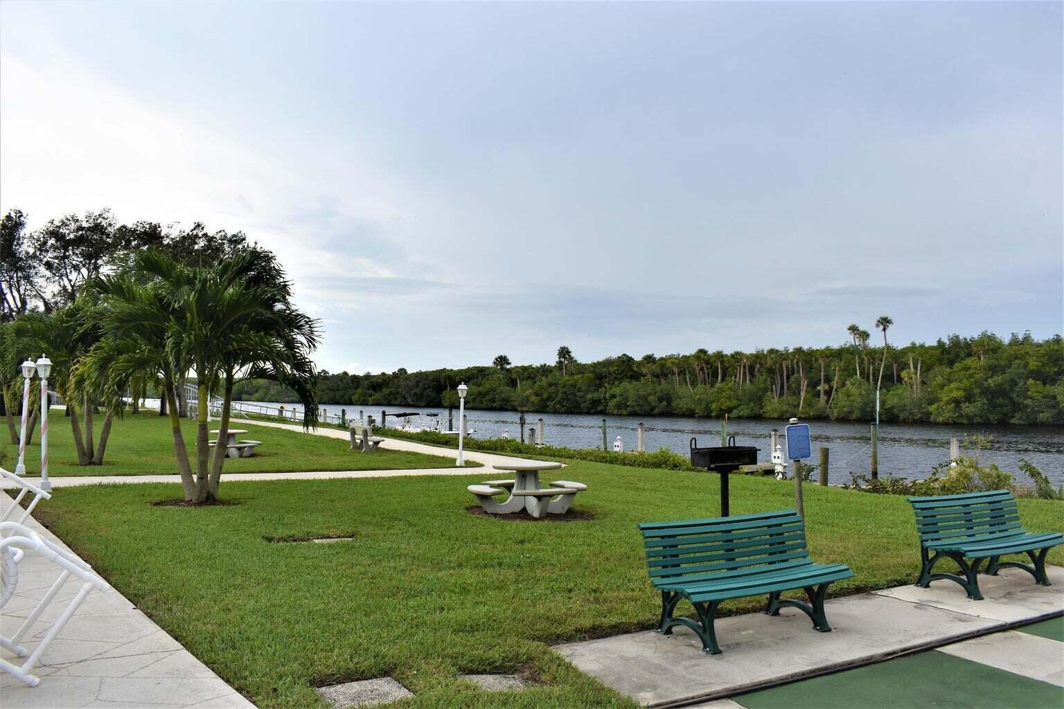 2502 Southeast Anchorage Cove, Unit 3 Port St. Lucie, FL 34952 - Photo 12 of 15 a view of a park with lounge chairs