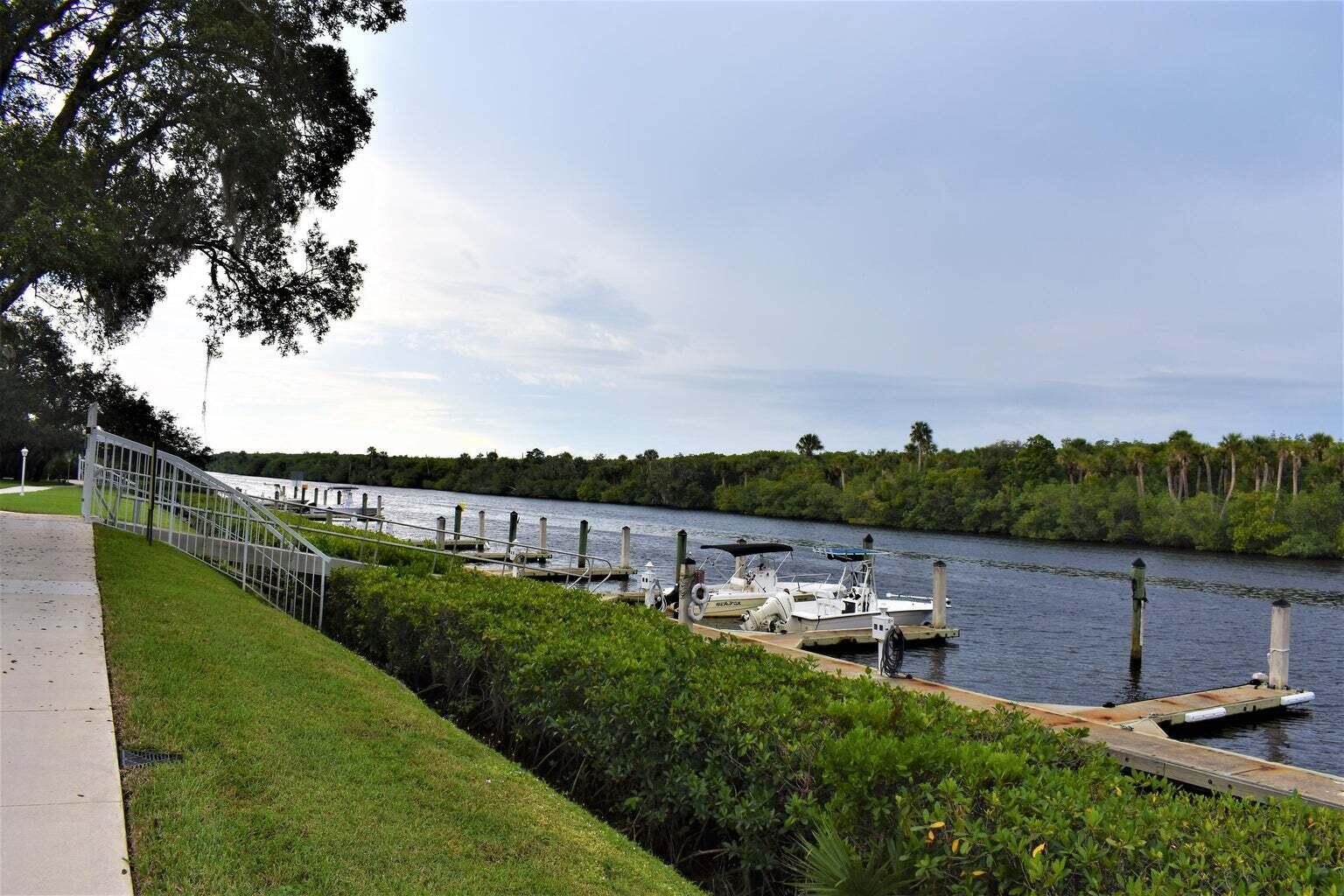 2502 Southeast Anchorage Cove, Unit 3 Port St. Lucie, FL 34952 - Photo 13 of 15 a view of a garden with lake view