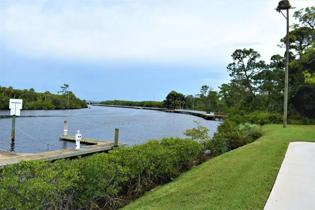 a view of a lake with a yard