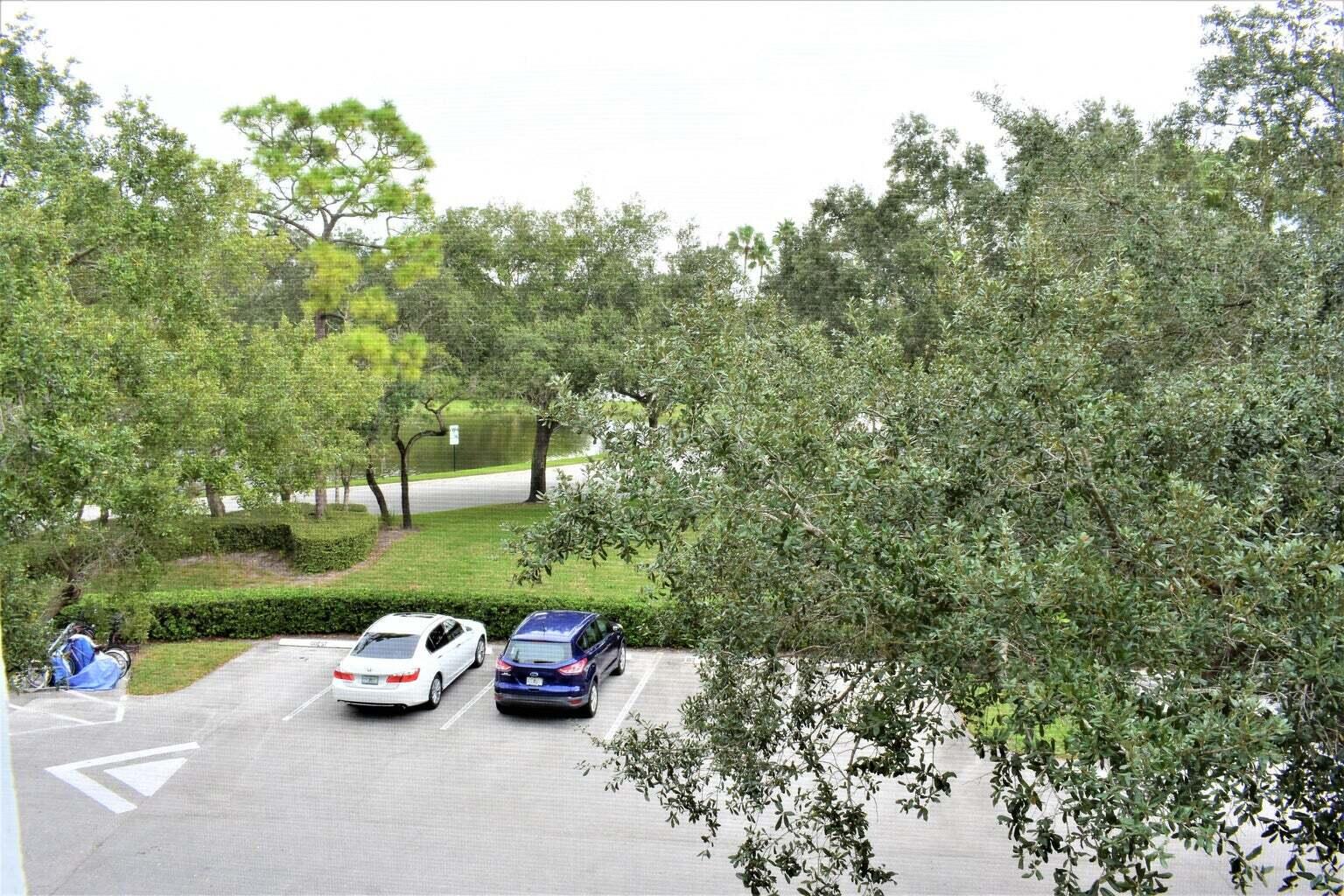 2502 Southeast Anchorage Cove, Unit 3 Port St. Lucie, FL 34952 - Photo 6 of 15 an outdoor view with a garden