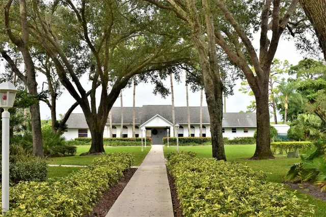 a house with trees in front of it