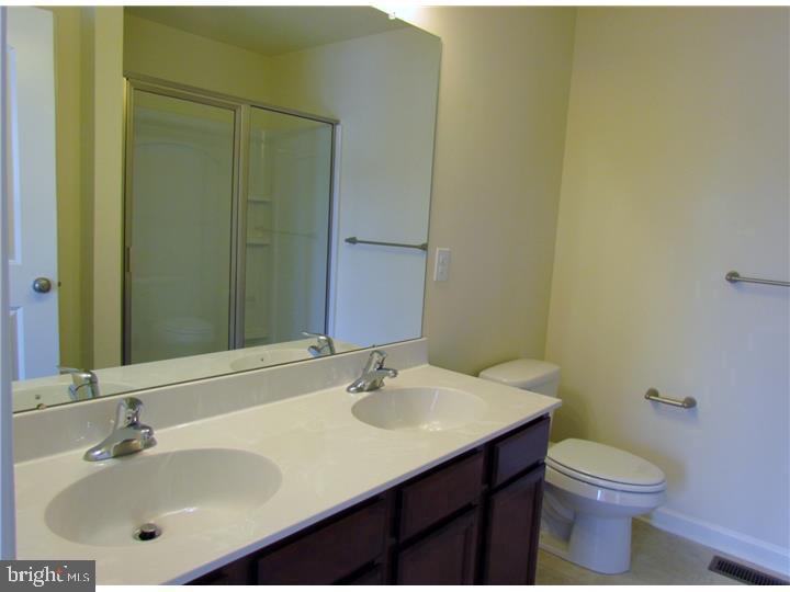 3889 Cephas Child Road, Unit 13 Doylestown, PA 18902 - Photo 17 of 25 a bathroom with a sink and a toilet