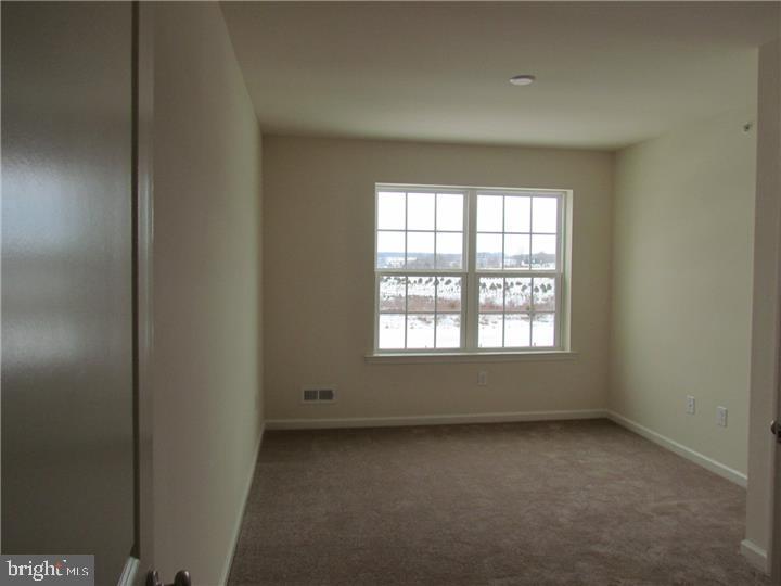 3889 Cephas Child Road, Unit 13 Doylestown, PA 18902 - Photo 18 of 25 an empty room with a window