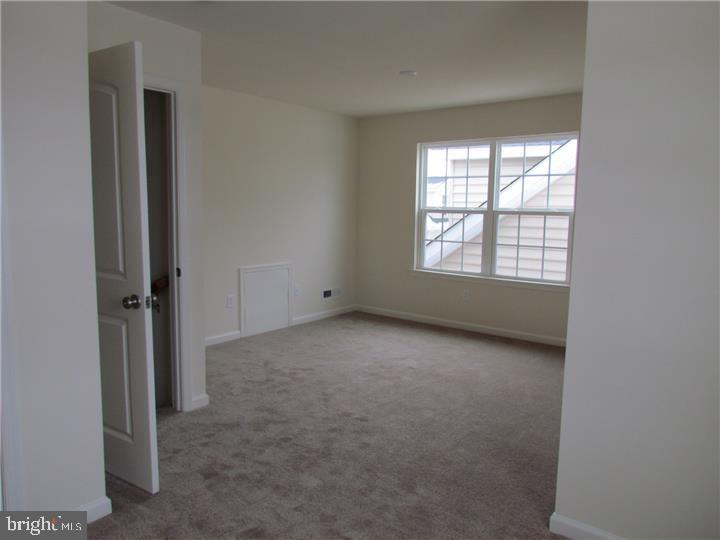 3889 Cephas Child Road, Unit 13 Doylestown, PA 18902 - Photo 20 of 25 an empty room with a window