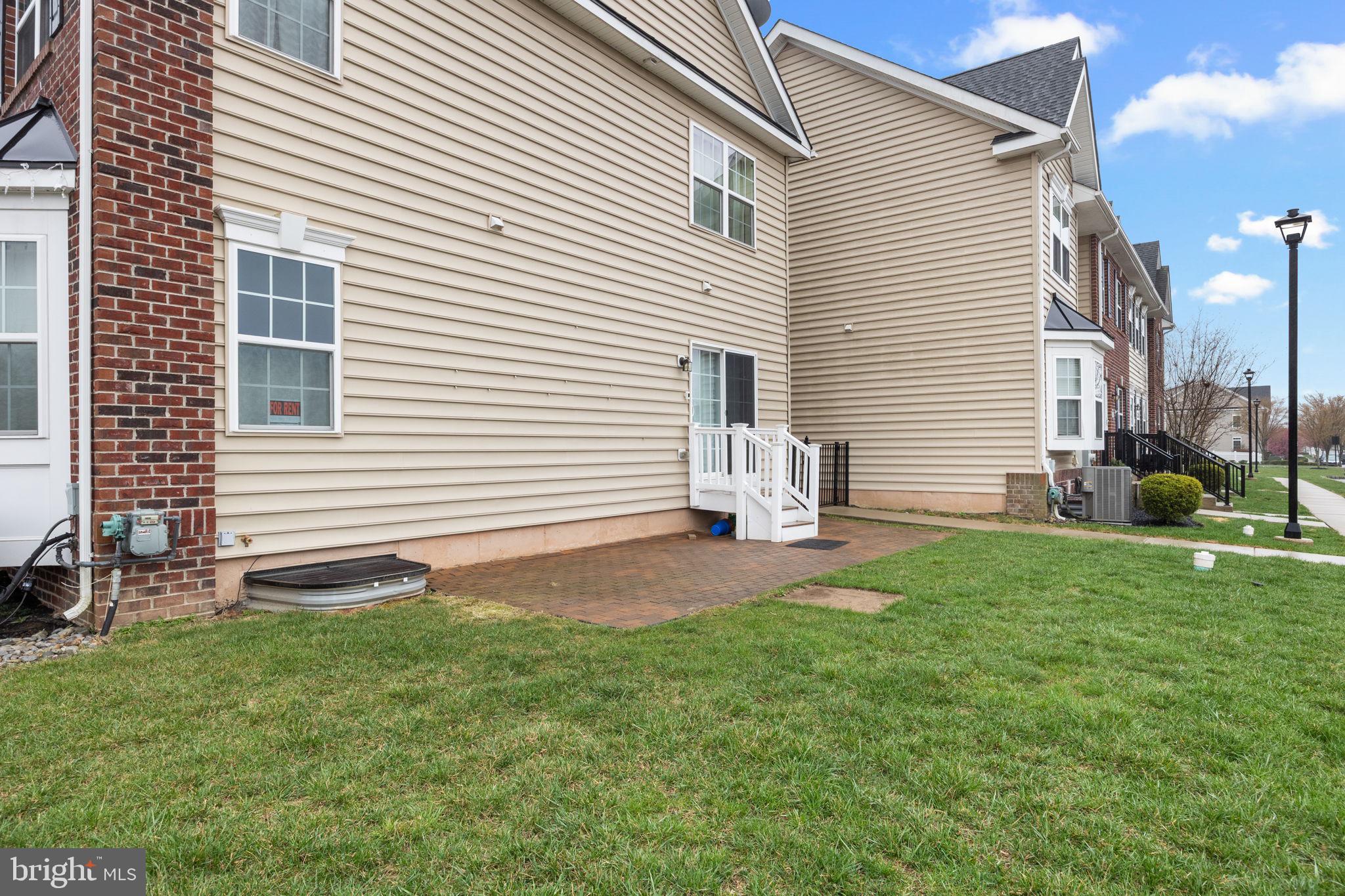 3889 Cephas Child Road, Unit 13 Doylestown, PA 18902 - Photo 4 of 25 a view of back yard of the house