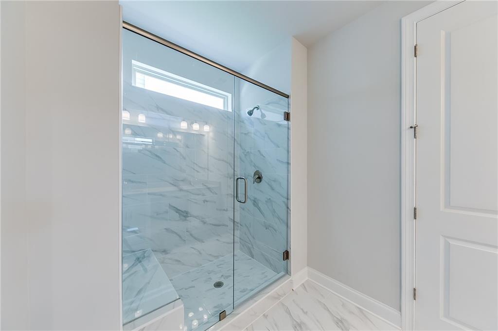 118 Classic Overlook Homer, GA 30547 - Photo 21 of 42 a bathroom with a glass shower door