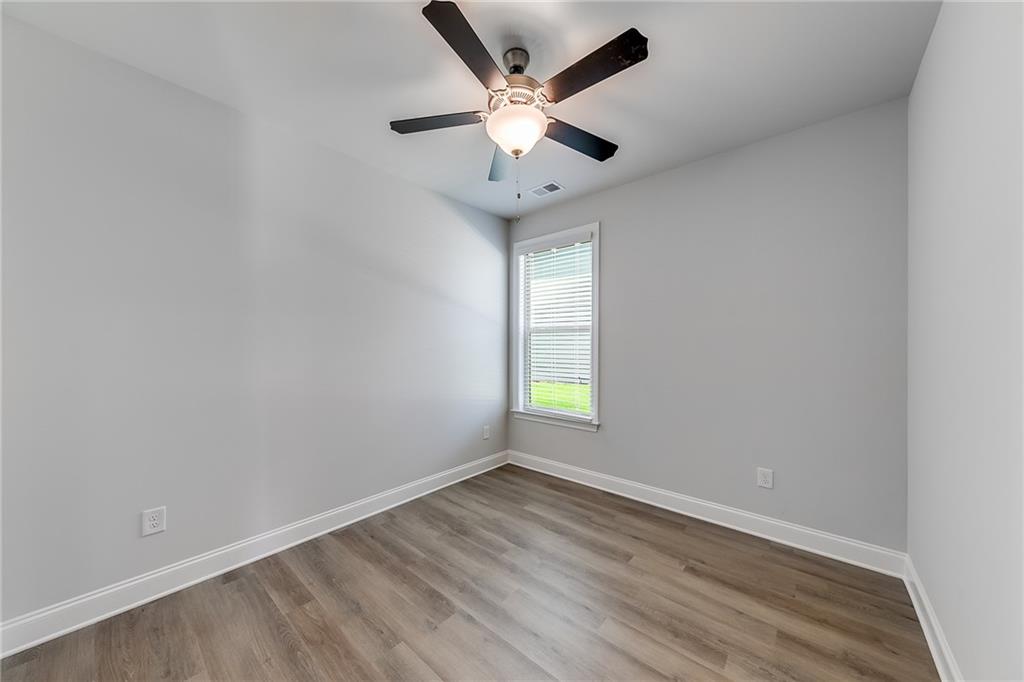 118 Classic Overlook Homer, GA 30547 - Photo 26 of 42 an empty room with window and ceiling fan