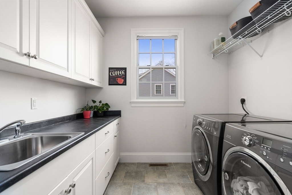 22 Oakencroft Road Wellesley, MA 02482 - Photo 19 of 40 a utility room with closet dryer and washer