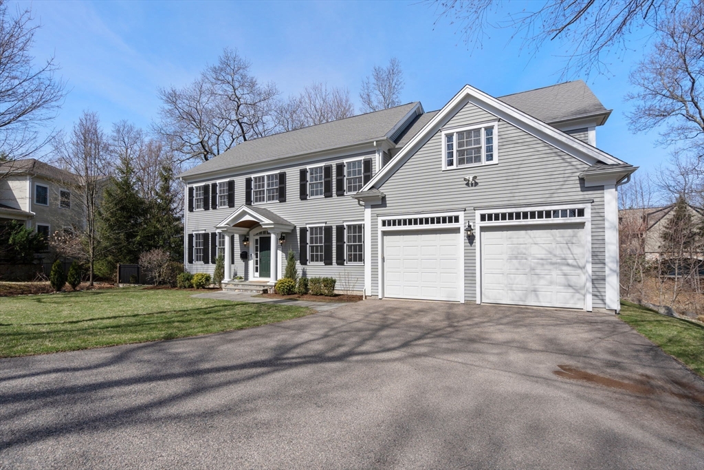 22 Oakencroft Road Wellesley, MA 02482 - Photo 2 of 40 a front view of a house with a yard