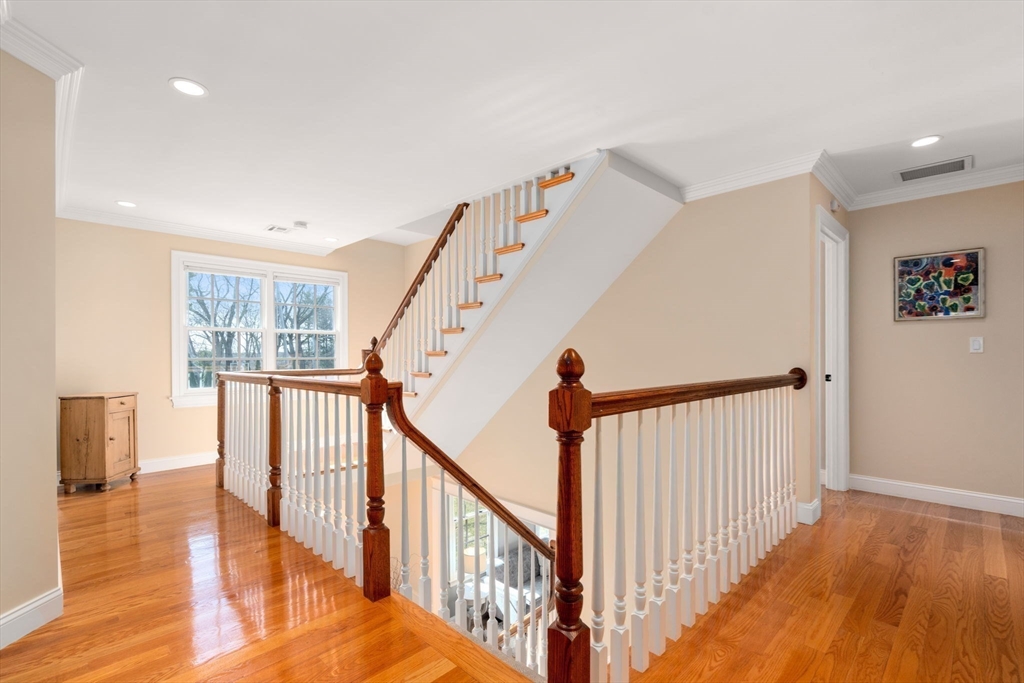22 Oakencroft Road Wellesley, MA 02482 - Photo 21 of 40 a view of a hallway with wooden floor and stairs