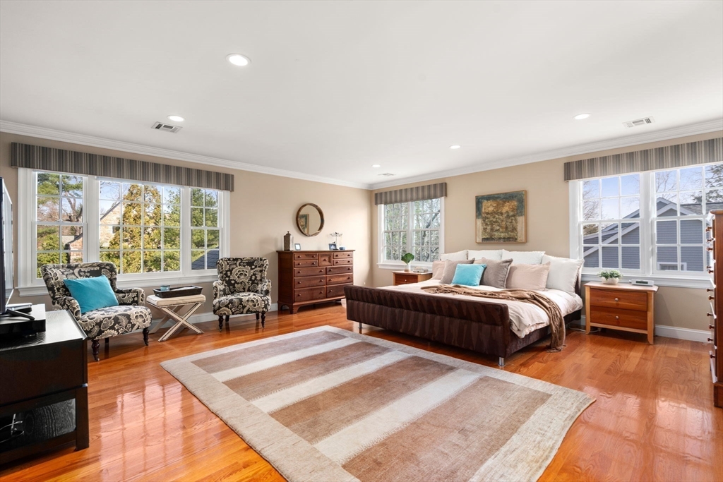 22 Oakencroft Road Wellesley, MA 02482 - Photo 22 of 40 a bedroom with furniture and large windows