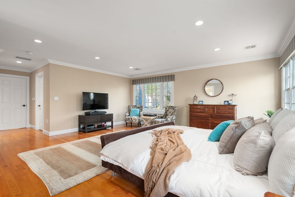 22 Oakencroft Road Wellesley, MA 02482 - Photo 23 of 40 a bed room with a bed a television and a large window