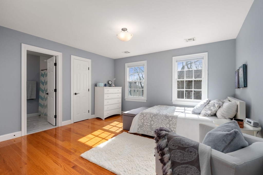 22 Oakencroft Road Wellesley, MA 02482 - Photo 28 of 40 a bedroom with a bed and wooden floor