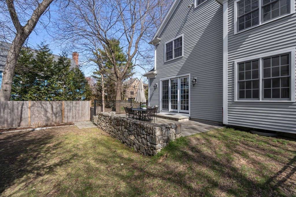 22 Oakencroft Road Wellesley, MA 02482 - Photo 35 of 40 a view of a backyard with a large tree