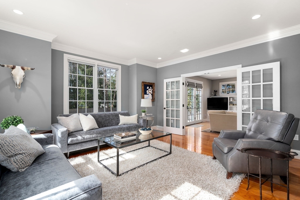 22 Oakencroft Road Wellesley, MA 02482 - Photo 5 of 40 a living room with furniture and floor to ceiling windows