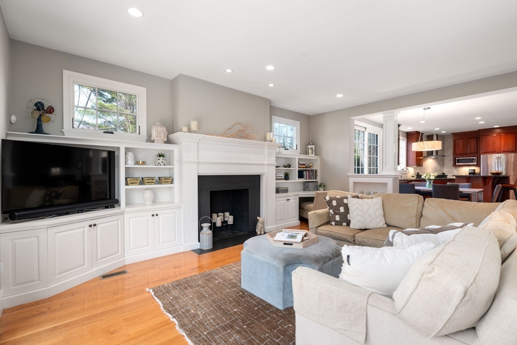 22 Oakencroft Road Wellesley, MA 02482 - Photo 8 of 40 a living room with furniture a flat screen tv and a fireplace