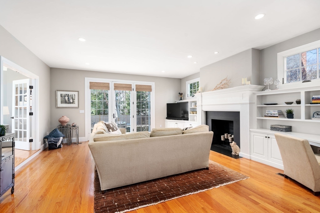 22 Oakencroft Road Wellesley, MA 02482 - Photo 9 of 40 a living room with furniture a fireplace and a large window