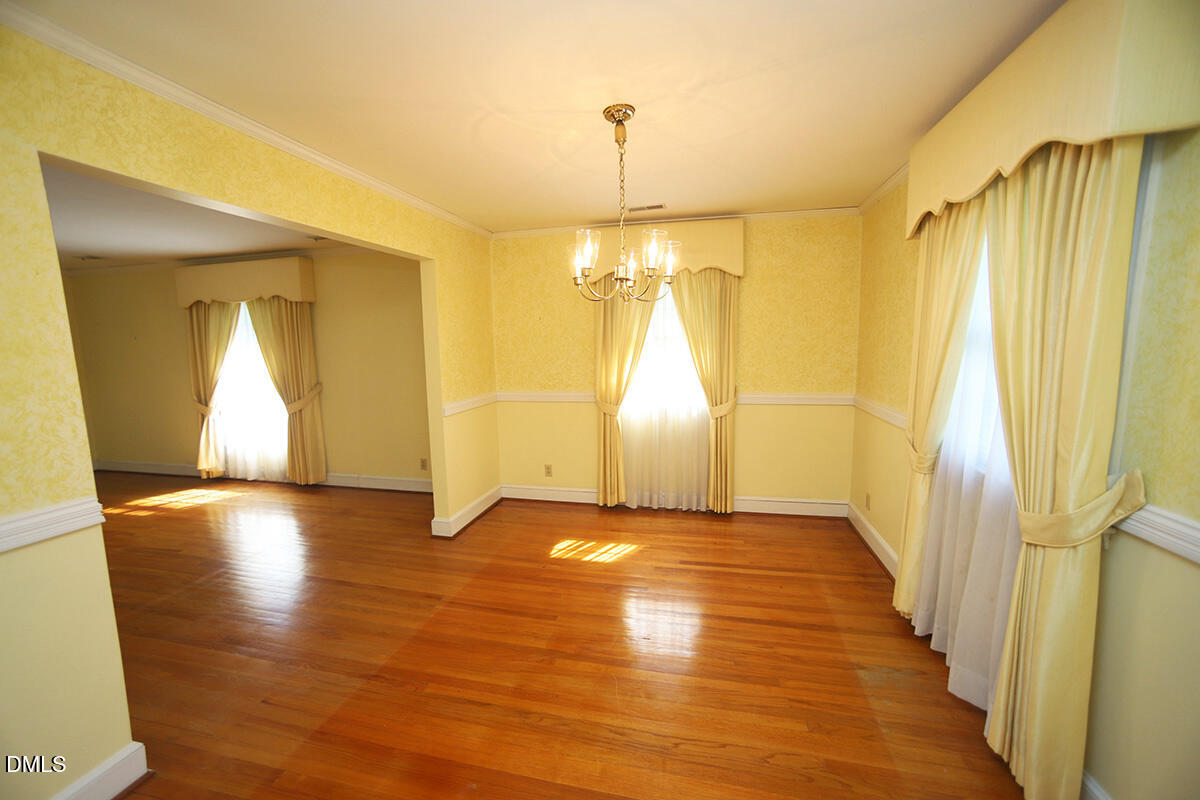 3518 Randolph Road Durham, NC 27705 - Photo 23 of 32 a view of empty room with wooden floor and fan