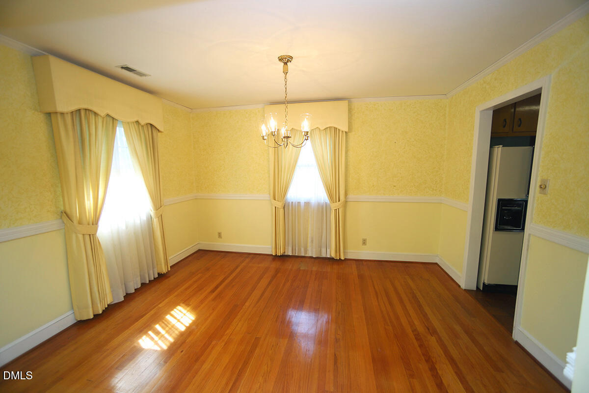 3518 Randolph Road Durham, NC 27705 - Photo 24 of 32 a view of empty room with wooden floor and window
