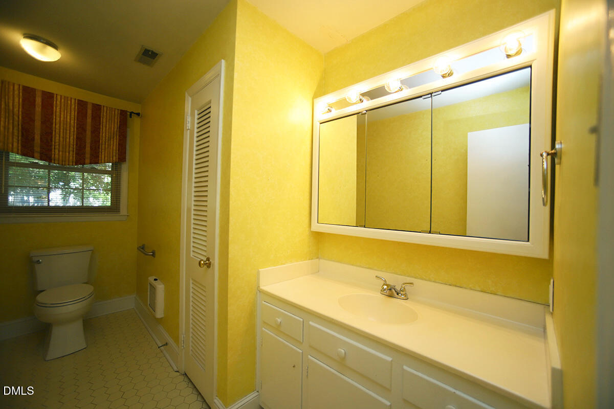 3518 Randolph Road Durham, NC 27705 - Photo 29 of 32 a bathroom with a bathtub and a shower