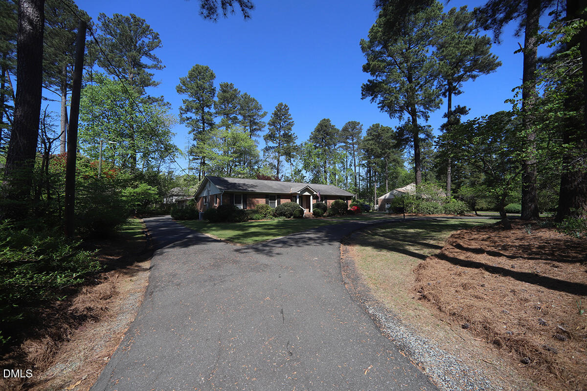 3518 Randolph Road Durham, NC 27705 - Photo 3 of 32 a view of a street with a bench in the background