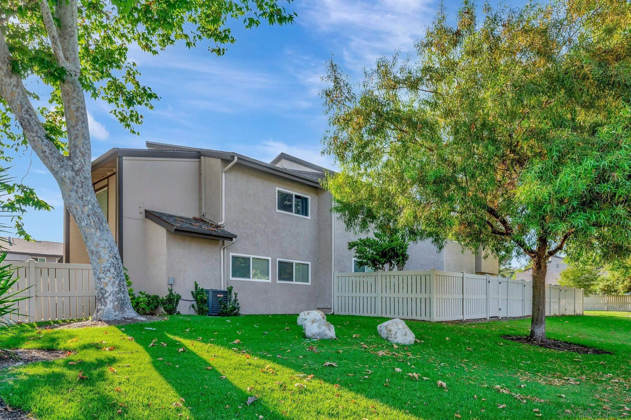 a backyard of a house with lots of green space