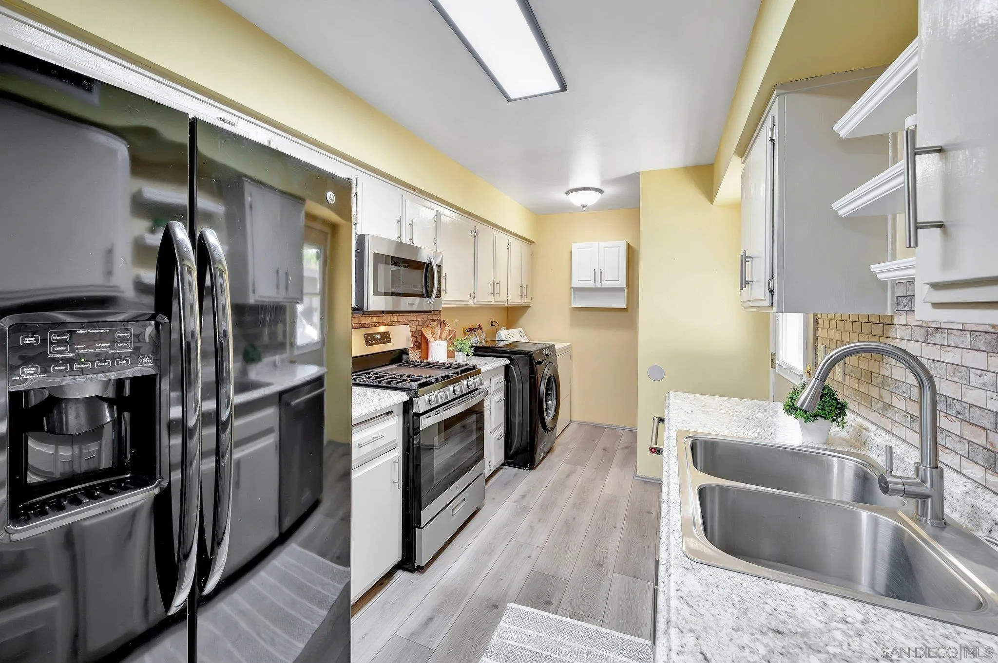 14247 Anabelle Drive Poway, CA 92064 - Photo 11 of 33 a kitchen with stainless steel appliances granite countertop a sink stove and refrigerator