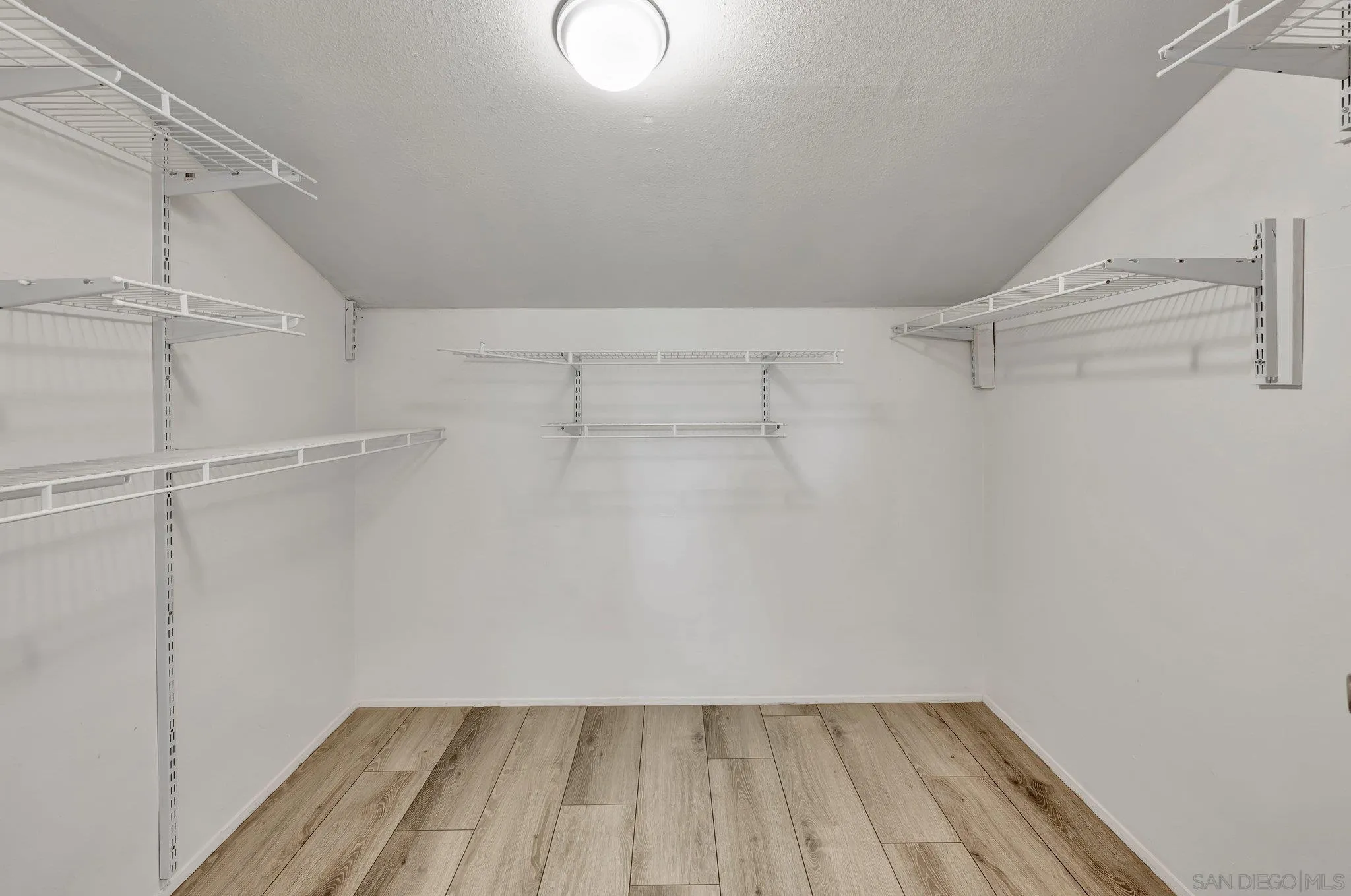 14247 Anabelle Drive Poway, CA 92064 - Photo 18 of 33 a view of a room with racks on the wall