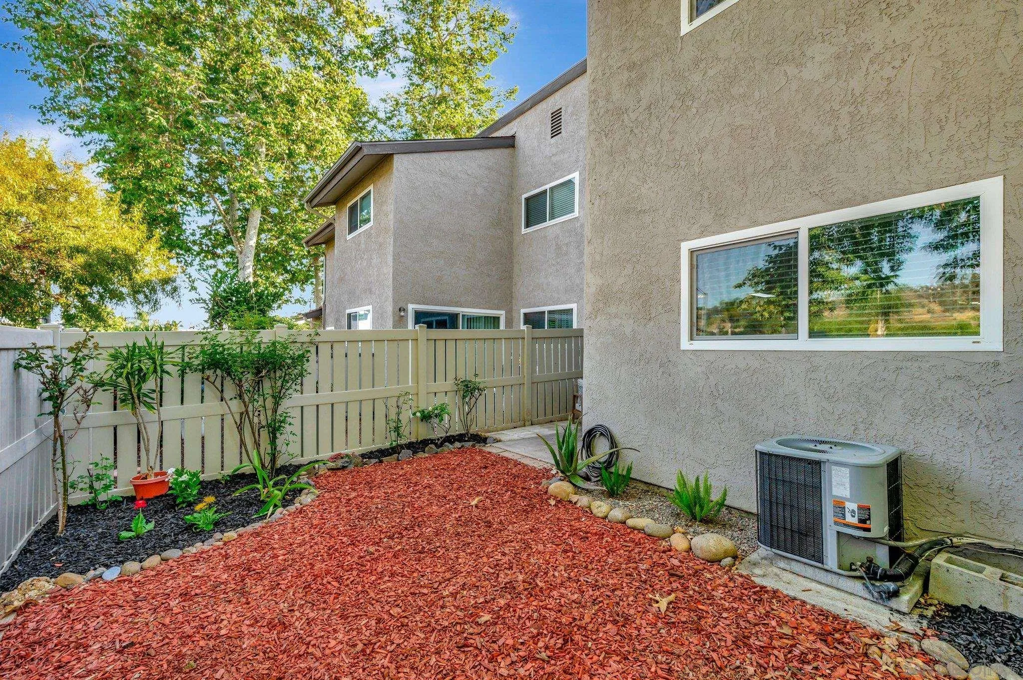 14247 Anabelle Drive Poway, CA 92064 - Photo 25 of 33 a backyard of a house with plants and tree