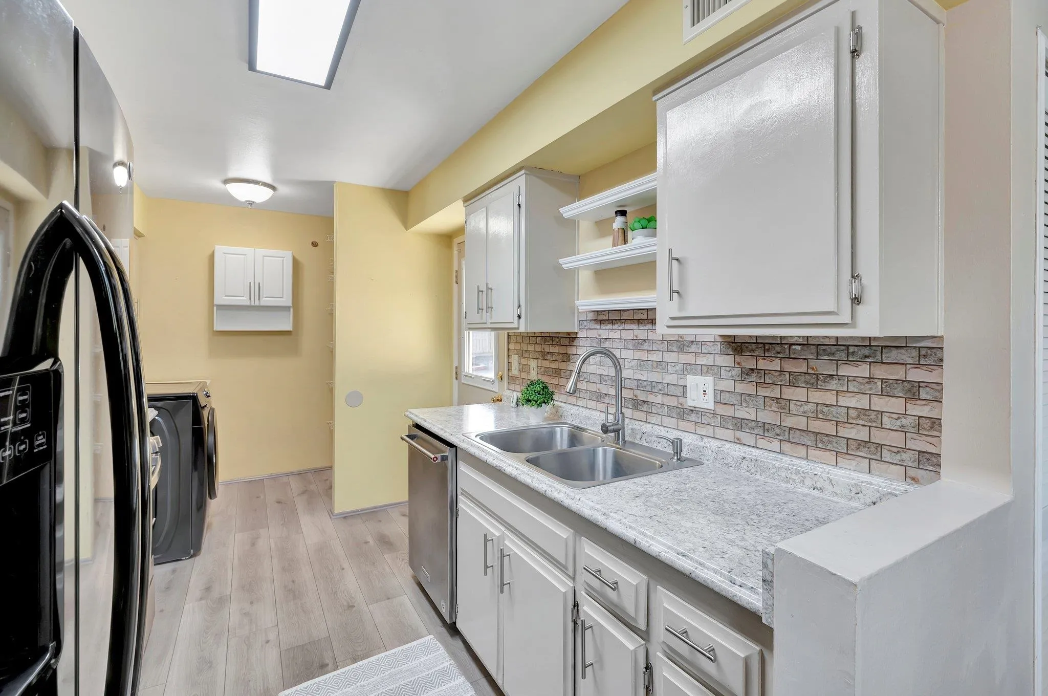 14247 Anabelle Drive Poway, CA 92064 - Photo 7 of 33 a kitchen with stainless steel appliances granite countertop a sink and a refrigerator