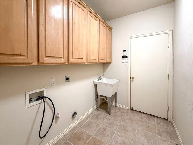 a bathroom with a sink a toilet and a window