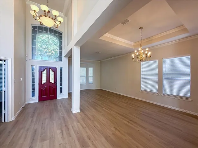 a view of an entryway with wooden floor