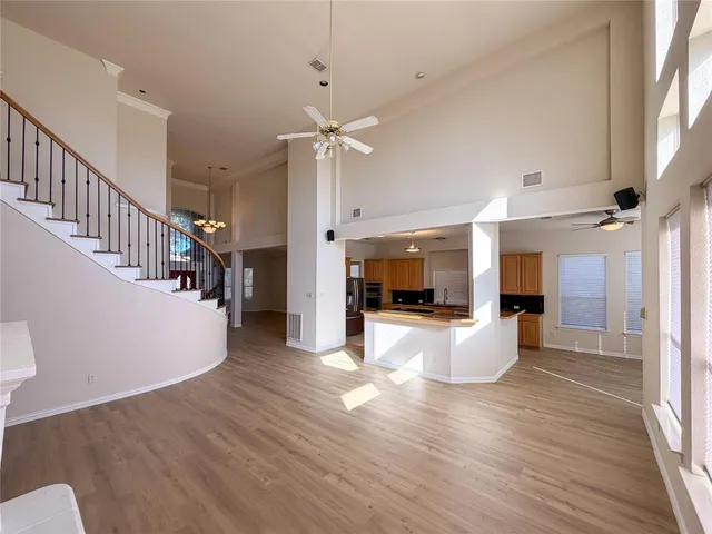a view of living room with furniture and wooden floor