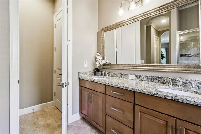 a view of a patio with a table and chairs under an umbrella