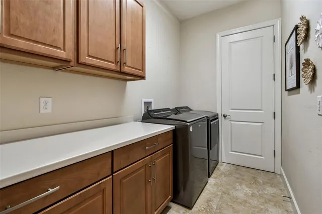 an aerial view of residential houses with outdoor space and swimming pool