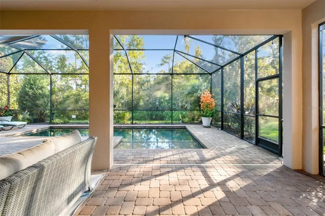 an aerial view of a house with a swimming pool outdoor space and swimming pool
